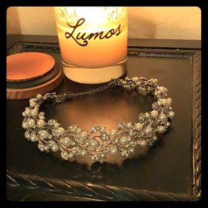 Matching silver chocker and earring set.